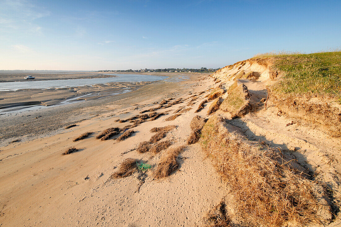 France. La Manche. Montmartin sur Mer,haven of Regneville sur Mer. Sunset. Area of erosion of beaches and dunes due to tides.