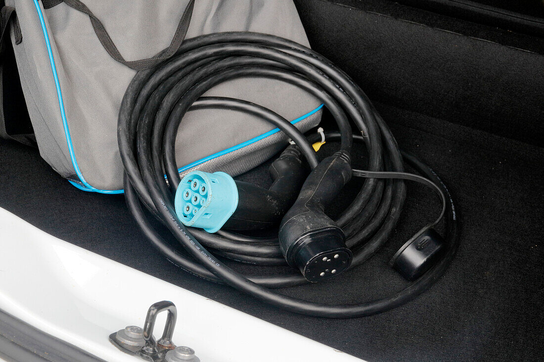 France. Seine et Marne. Electric car Renault Zoe. Close up on charging cable (type 2 and type 3) in the car trunk.