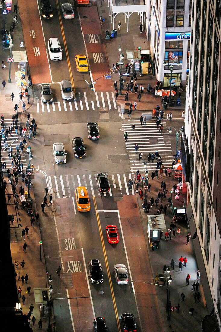 USA. New York City. Manhattan. Empire State Building. View from the top of the building at dusk and night. View of the seventh avenue in the direction of West Village.