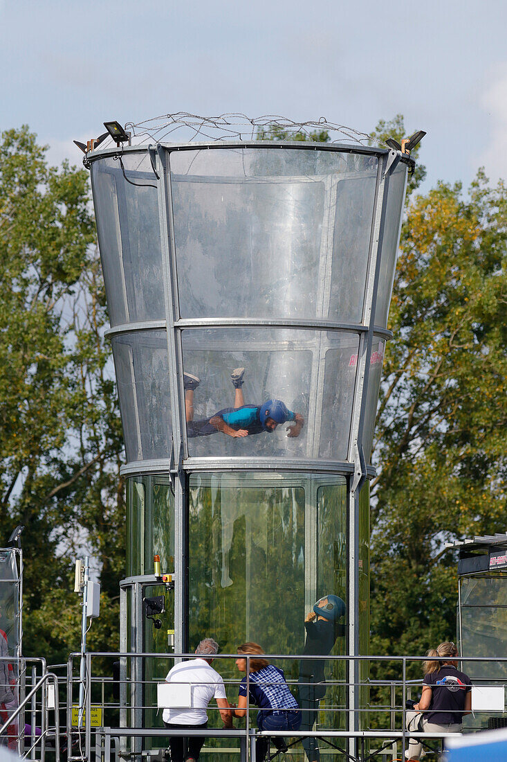 France. Seine et Marne. Melun. Airshow 2021. Free fall simulator. Child,teenager doing a baptism of free fall in front of his parents.