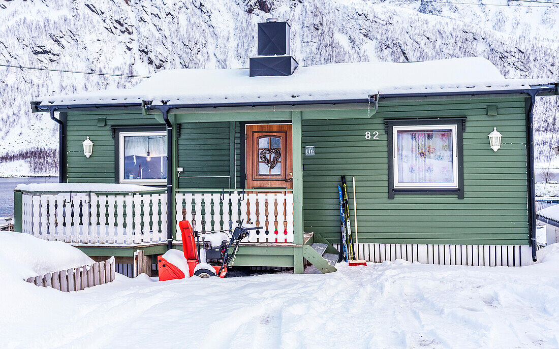 Norway,city of Tromso,Island of Senja,Ballesvika fjord,house in the snow