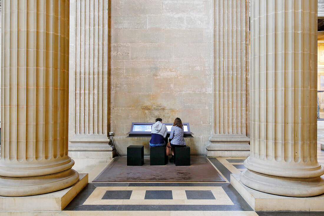 France. Paris. 5th district. The Pantheon. Tourists obtaining information on a computer terminal.