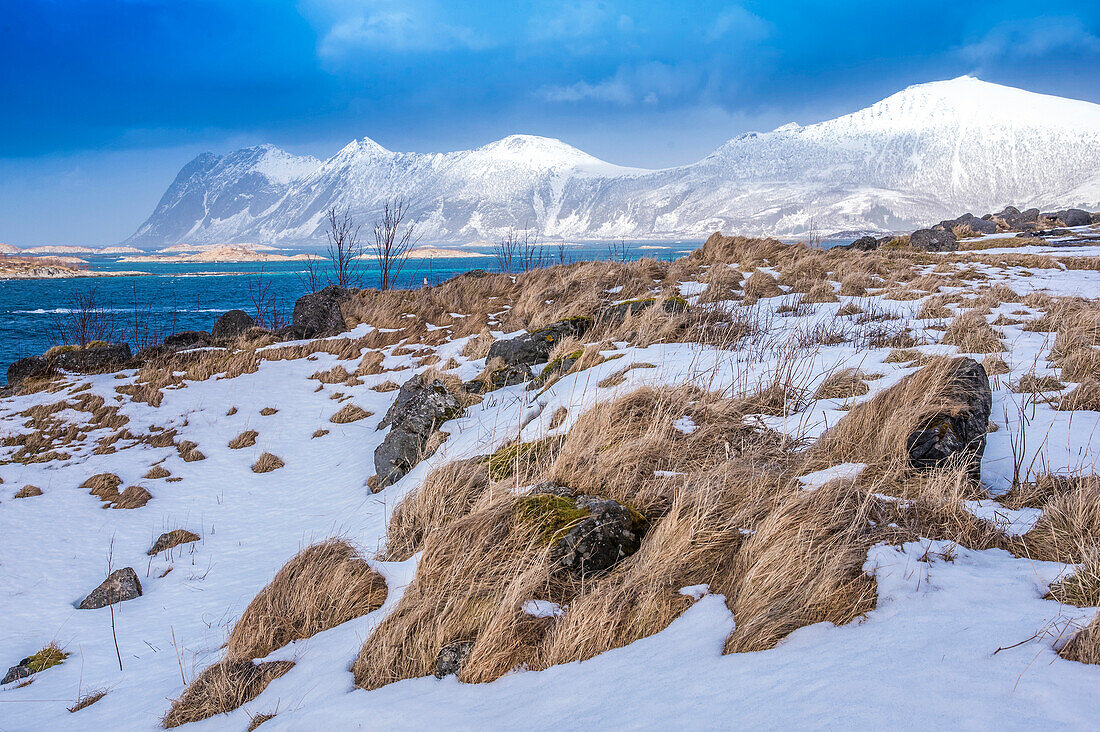 Norway,city of Tromso,Island of Senja,snowy landscape,snow on the sides of a fjord