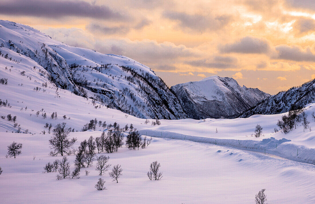 Norway,city of Tromso,Island of Senja,snowy landscape at sunrise