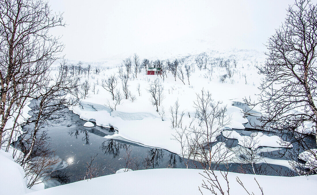 Norway,city of Tromso,Island of Senja,snowy landscape and a river