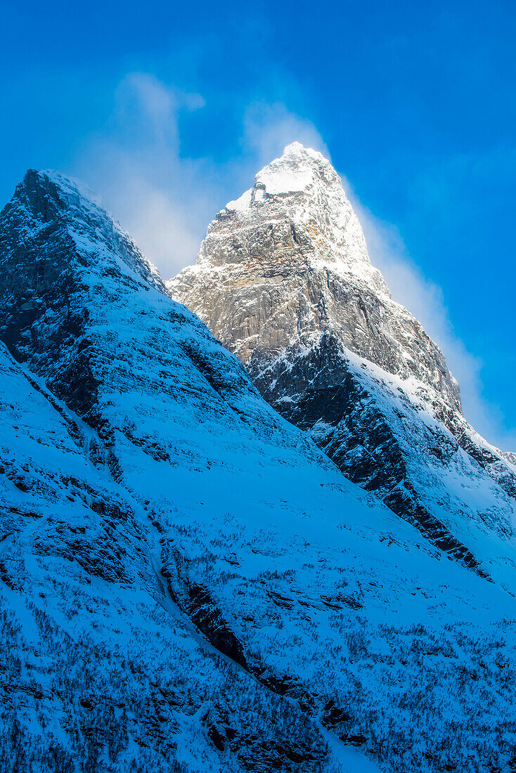 Norway,city of Tromso,sunrise on a mountain peak covered with snow