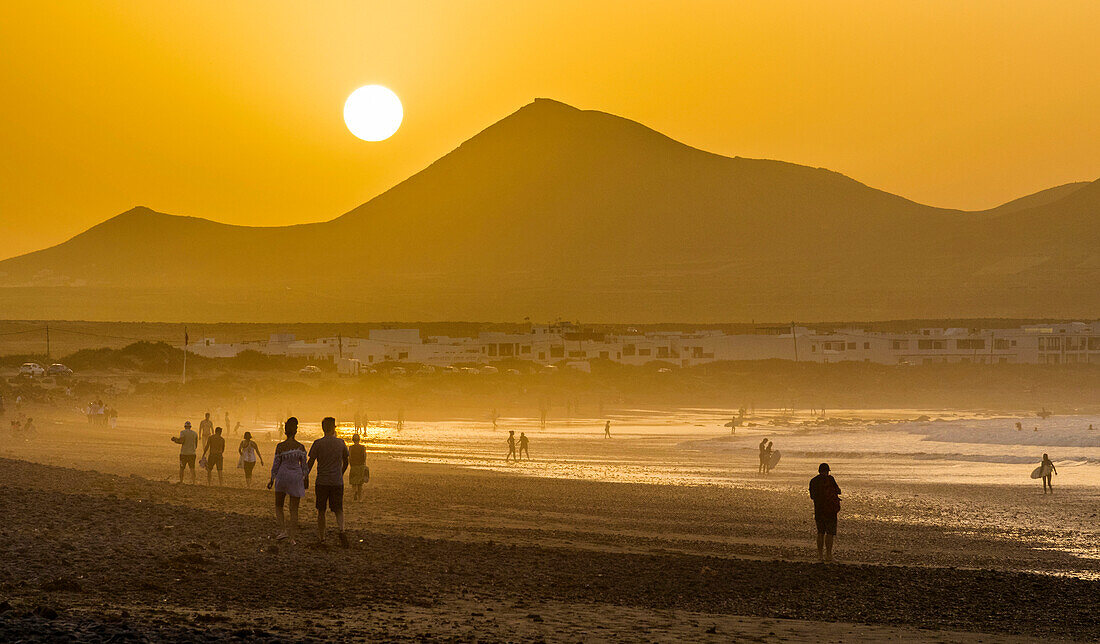 Spain,Canary Islands,Lanzarote Island,beach and village,sunset