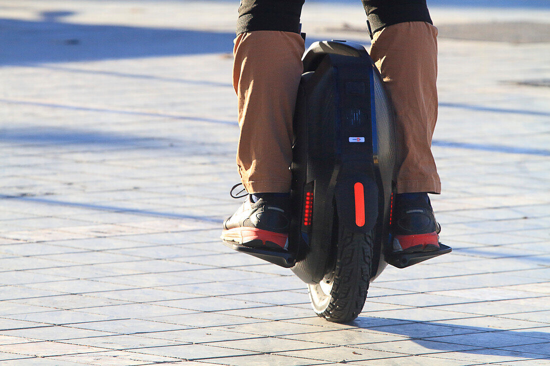 Man on self-balancing unicycle