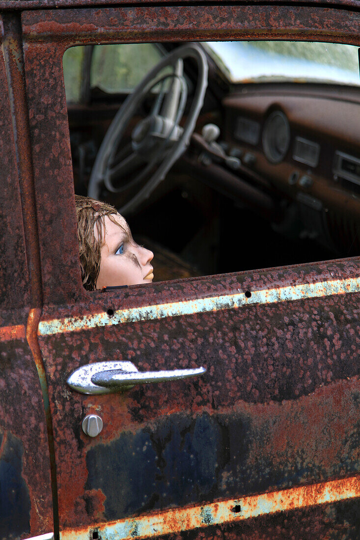 Usa,Florida. Everglades. Loop Road. Doll in a rusty car