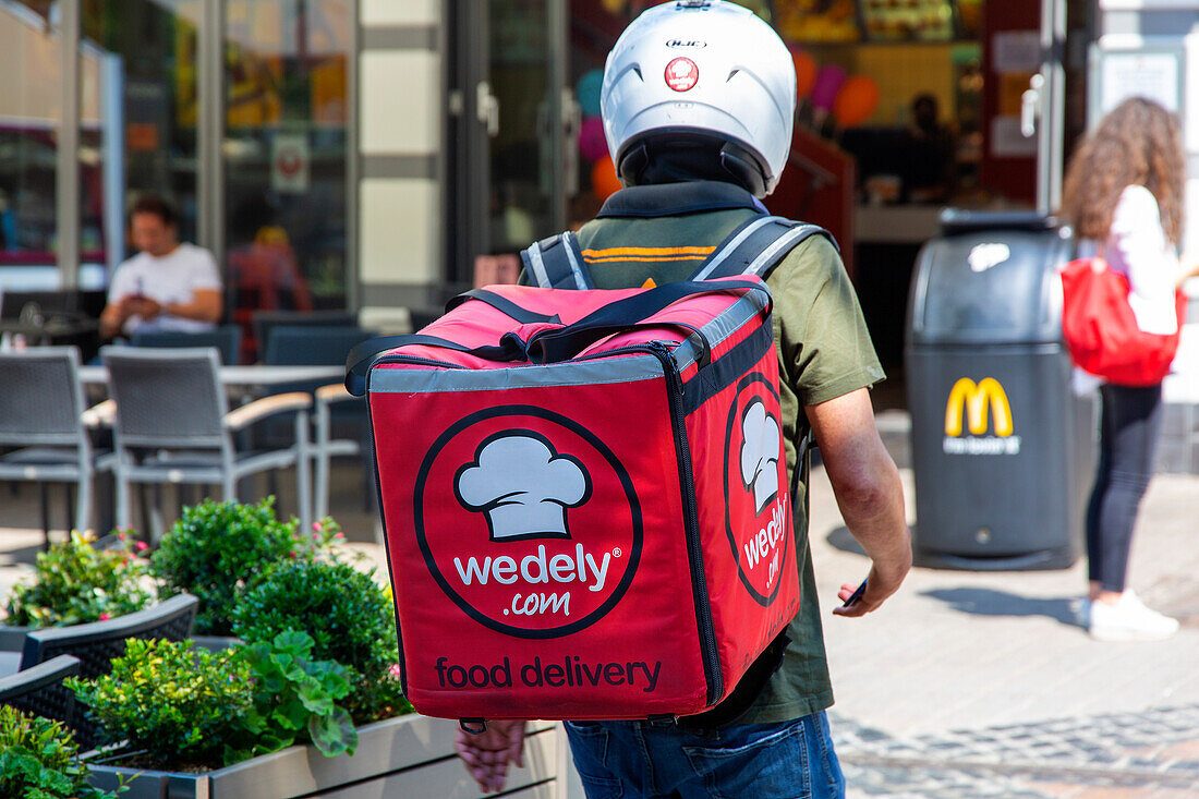 Luxembourg ,back delivery man,on foot with his bag