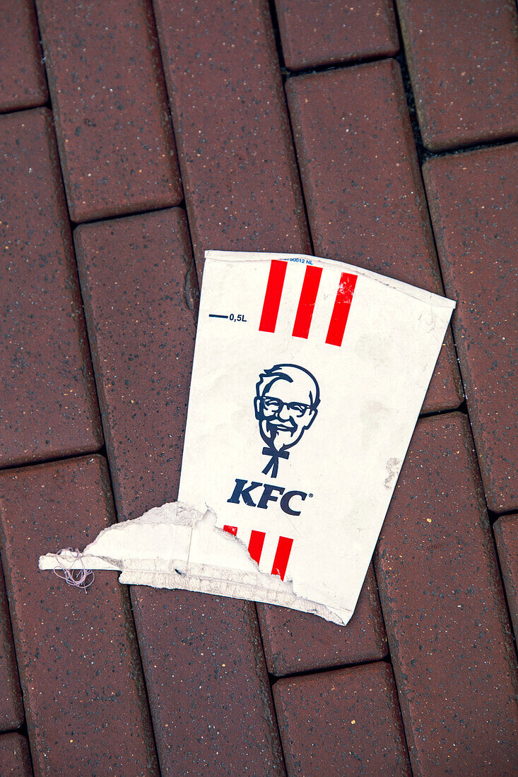 Europe,Nederlands. KFC cardboard glass crushed to the ground