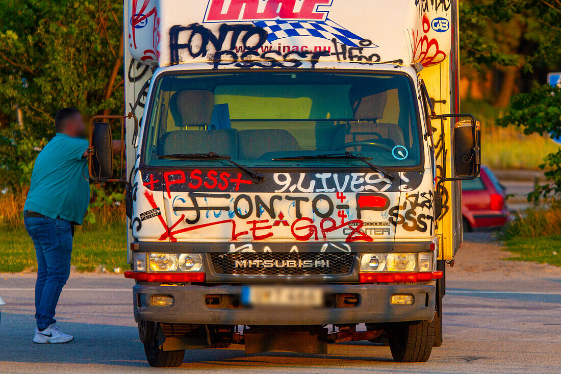 Delivery truck covered in tags