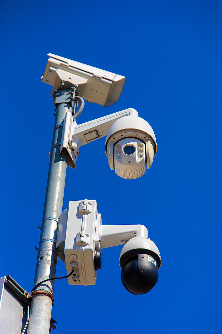 Surveillance camera in a blue sky