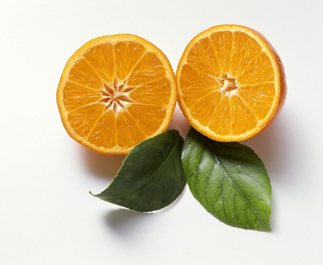A Halved Tangerine with Leaves