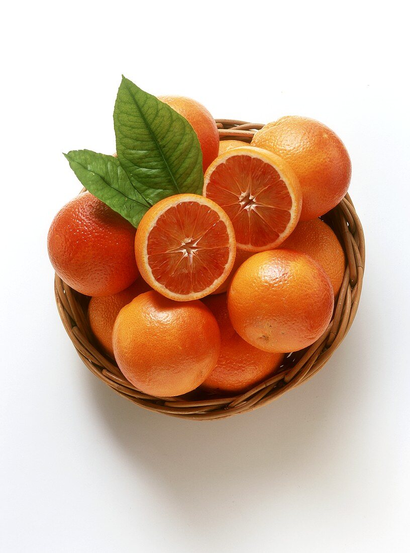 A Basket of Blood Oranges, One Cut in Half