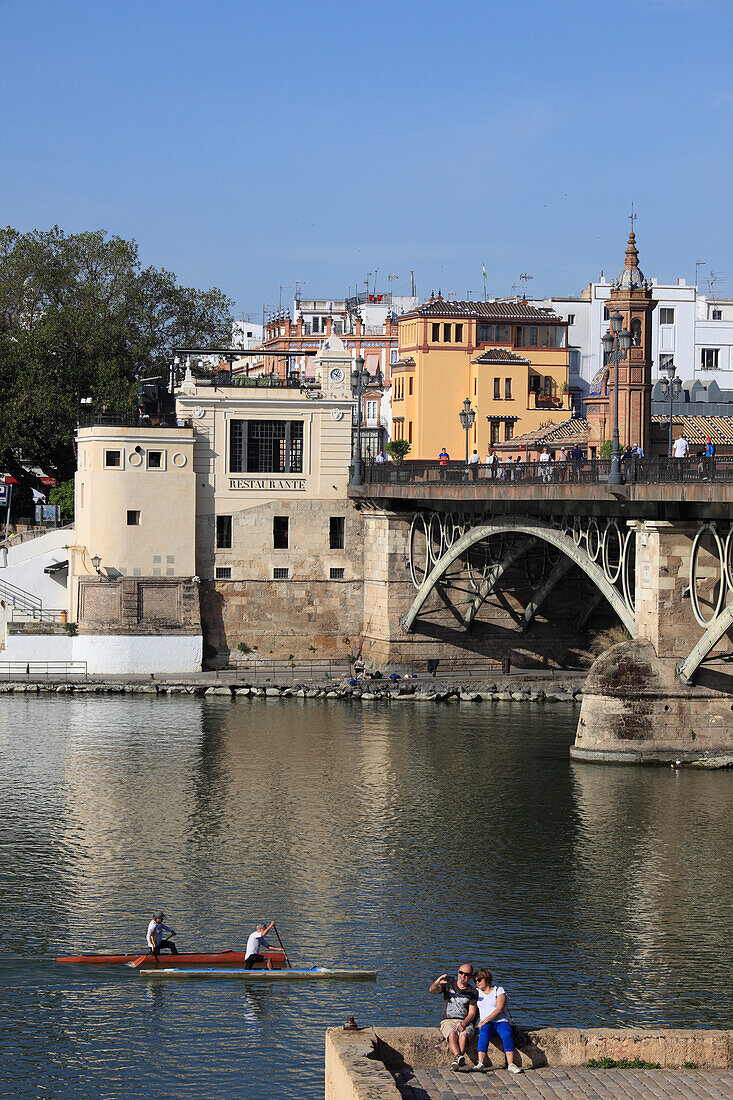 Spain,Andalusia,Seville,Puente de Isabel III,Castillo San Jorge,Guadalquivir River,people