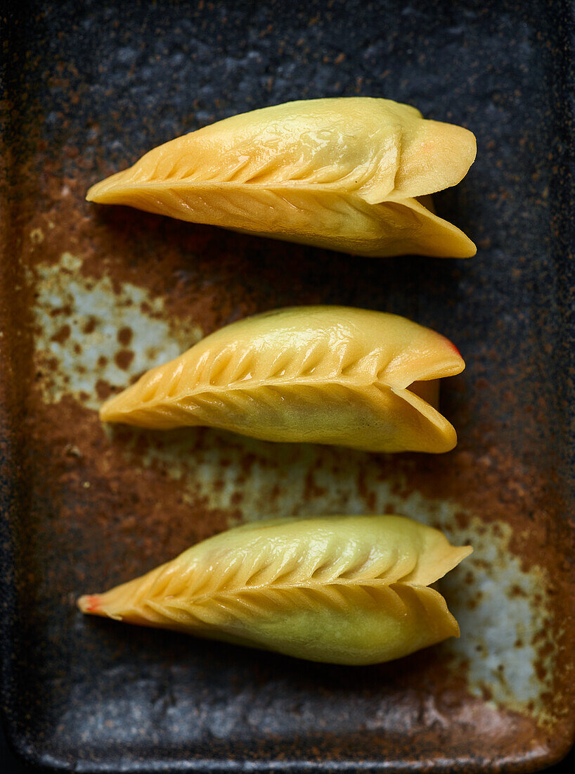 Steamed yellow gyozas