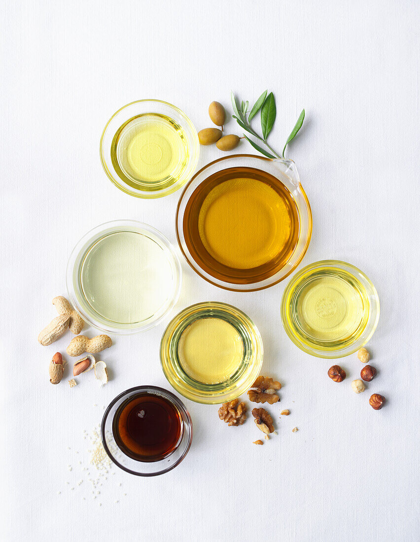 Various edible oils in glass bowls