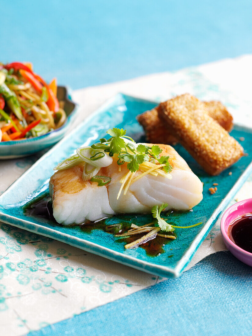 Steamed cod with prawn toast and vegetables