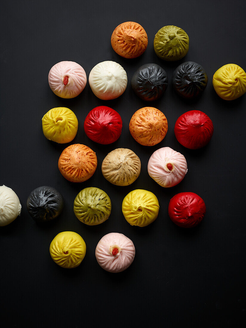 Steamed bao buns in different colours