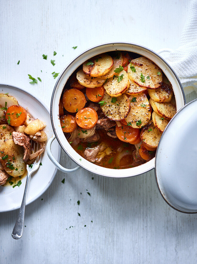 Hot pot with meat, potatoes and carrots
