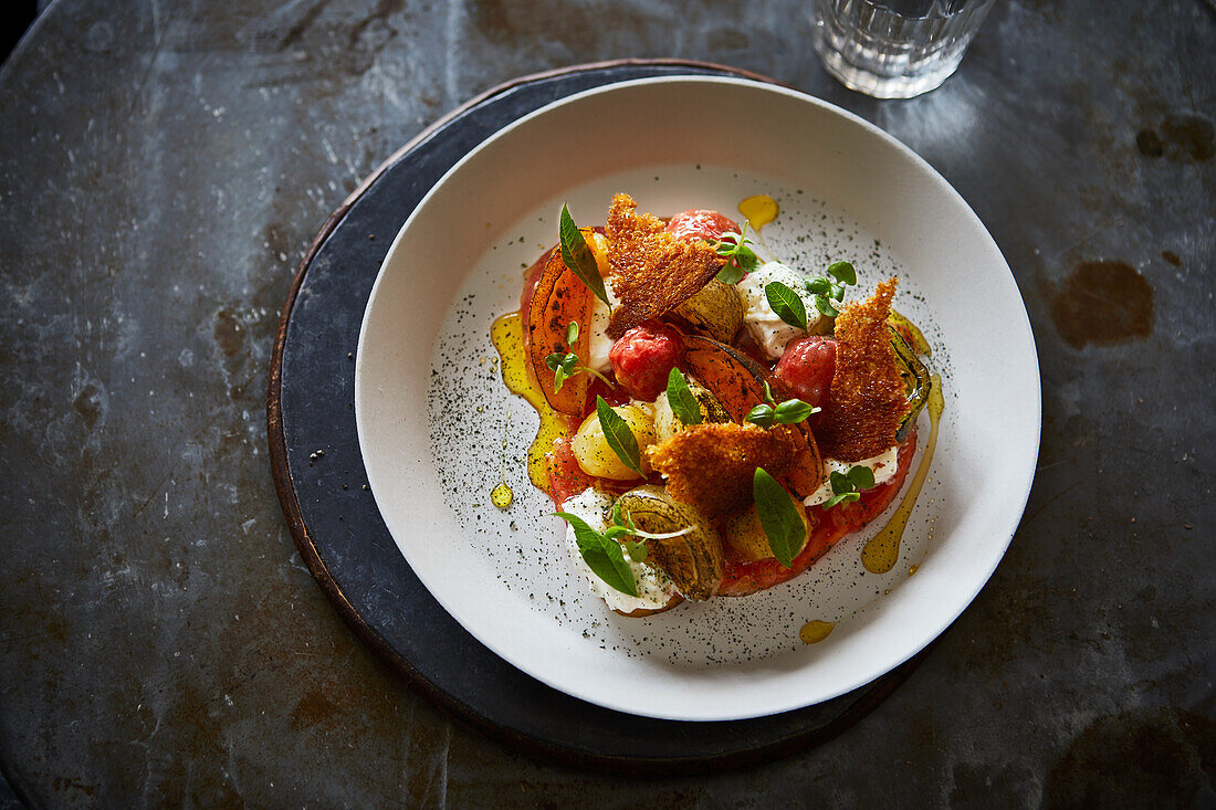 Tomato salad with crispy croutons and herbs