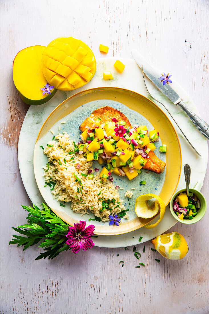 Trout fillet with mango salsa and rice