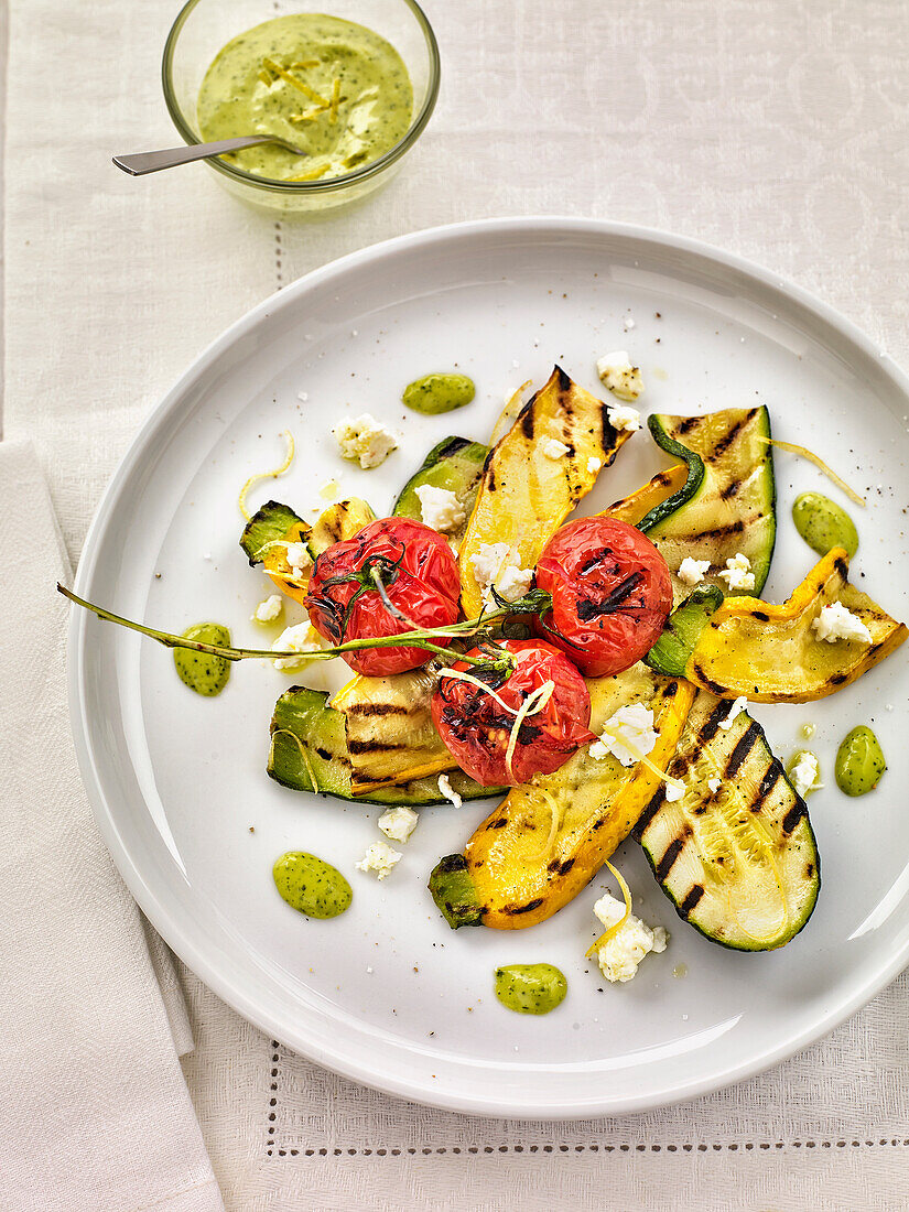 Roasted courgettes and tomatoes with goat's feta and parsley aïoli