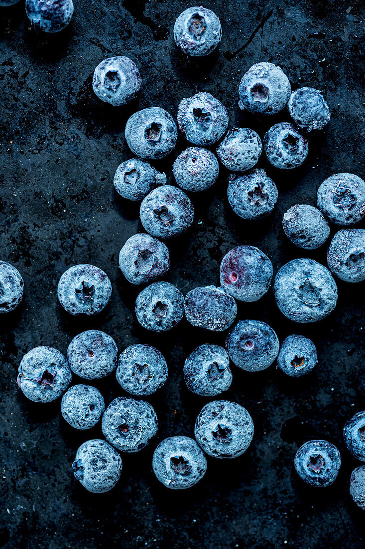 Frozen blueberries on a dark background