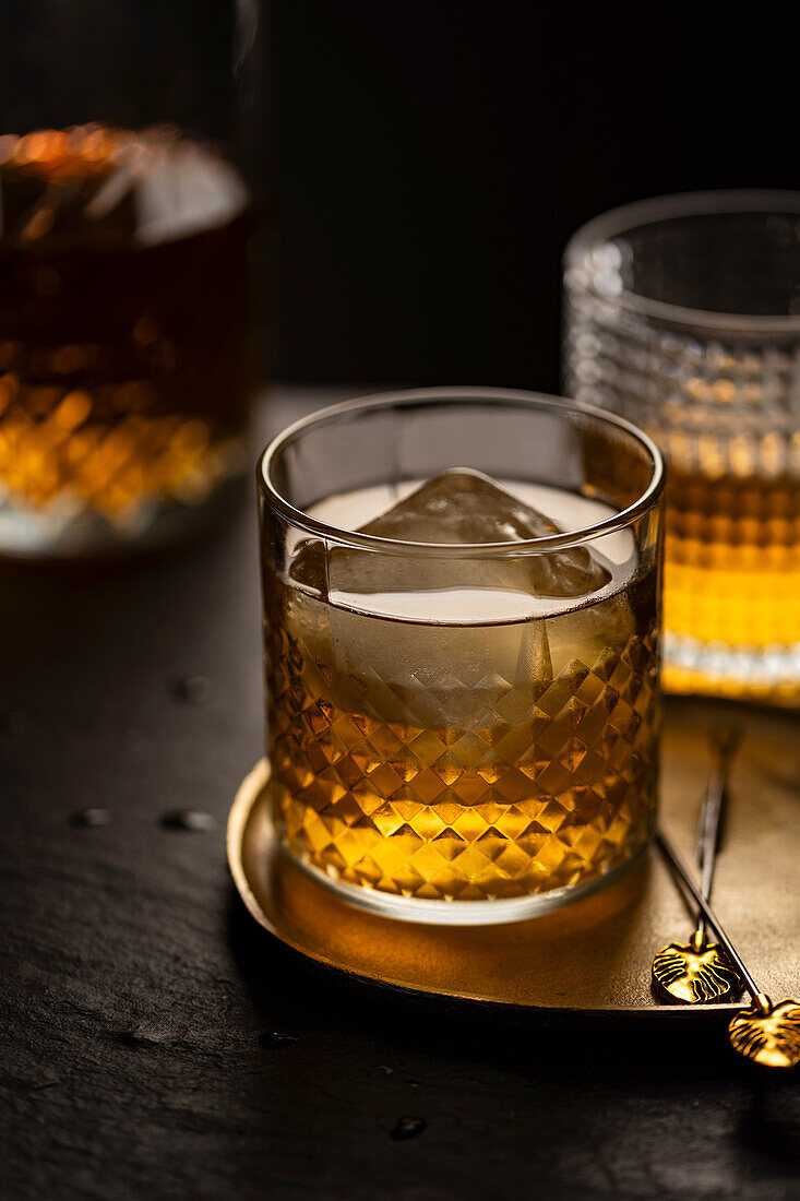 Whisky in a tumbler with ice cubes