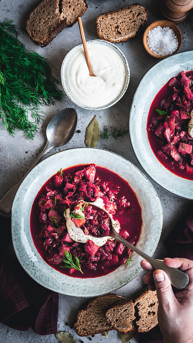 Vegetarian borscht with sour cream and dill