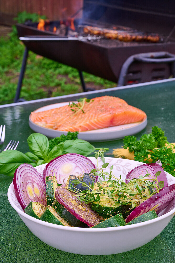 Courgettes and onions with herbs prepared for grilling