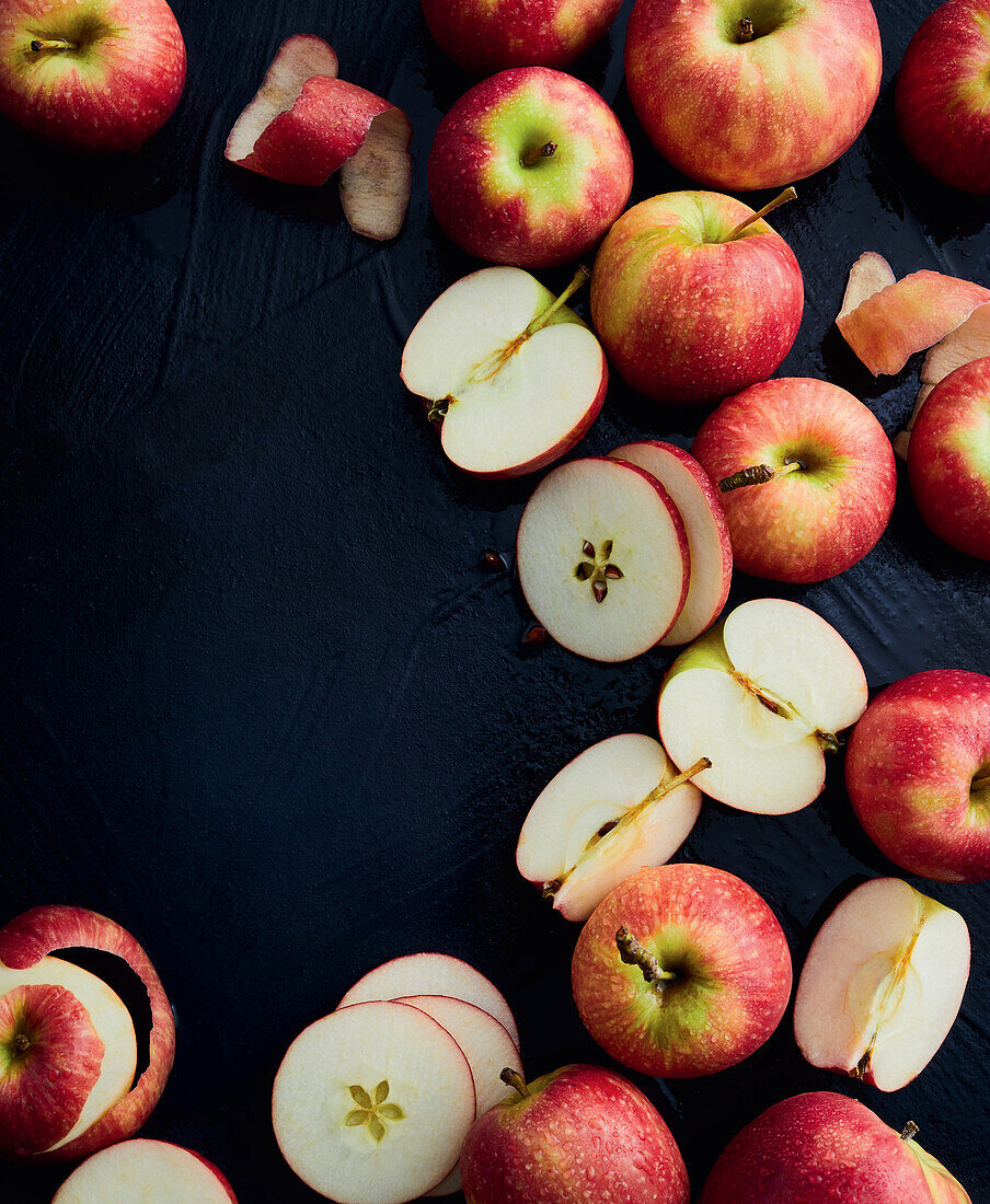 Whole and sliced Pink Lady apples