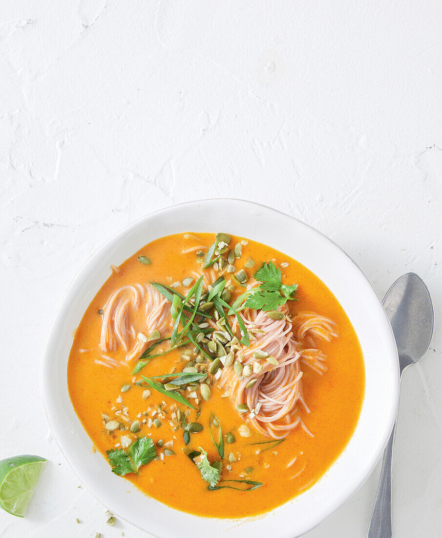 Pumpkin curry noodle soup with coriander