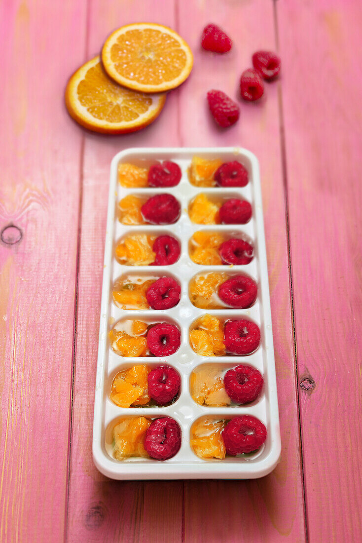 Raspberry and orange ice cubes