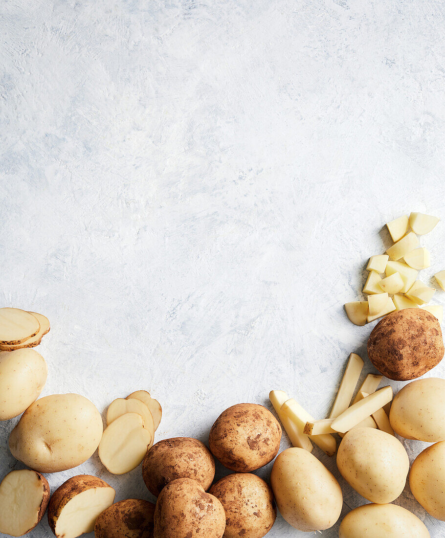 Raw potatoes, sliced and whole