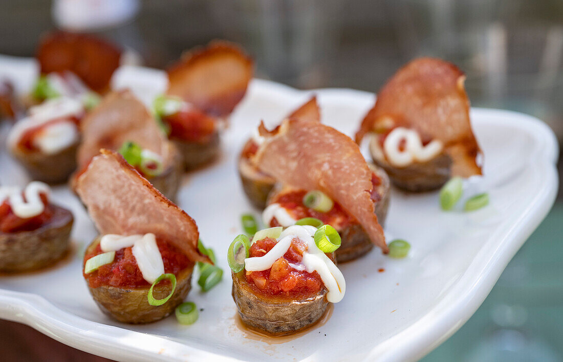 Mini patatas bravas with cured ham