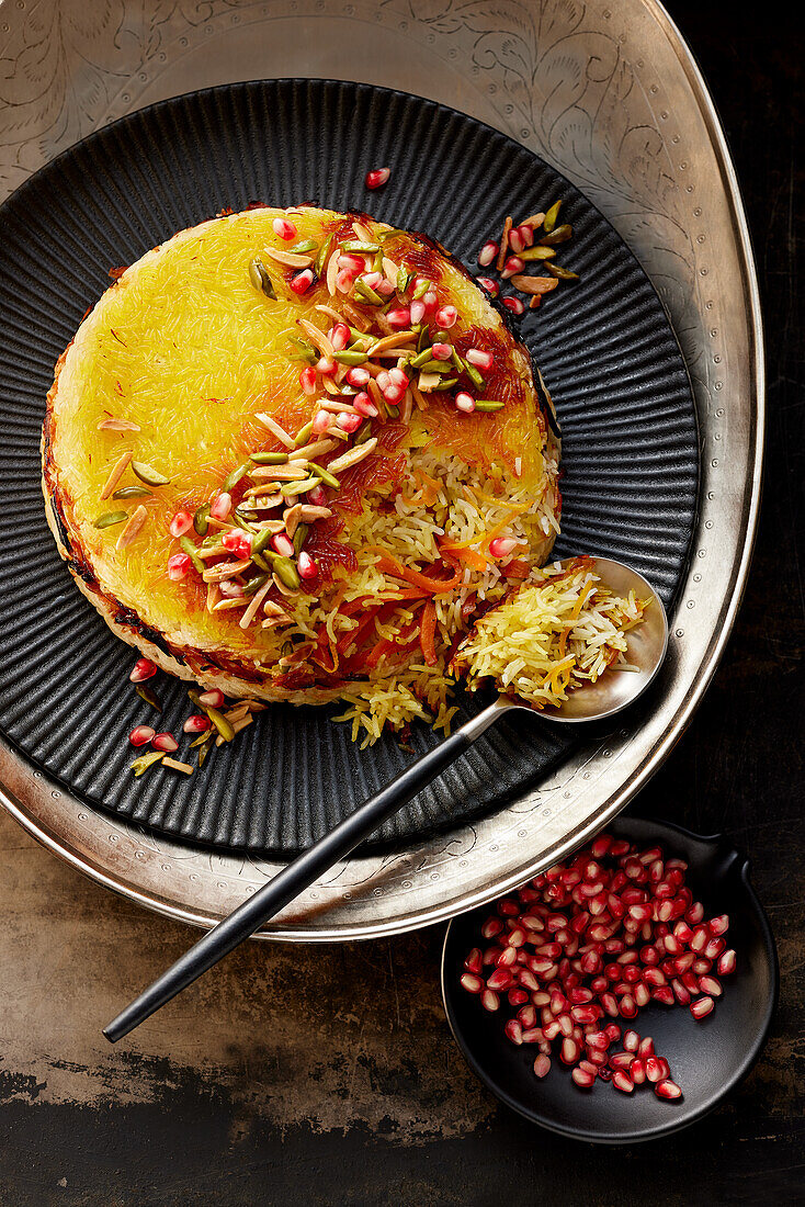 Jewel rice - Persian rice cake with saffron and pomegranate seeds