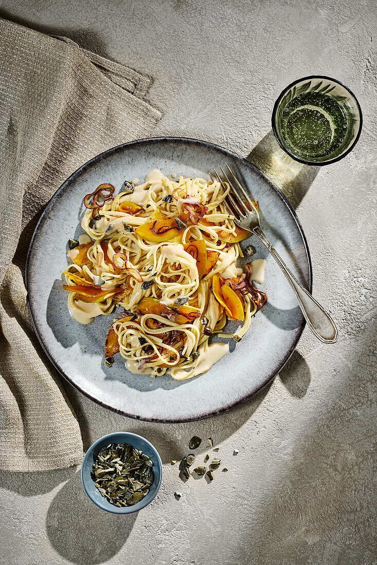 Butternut linguine with red onions and pumpkin seeds