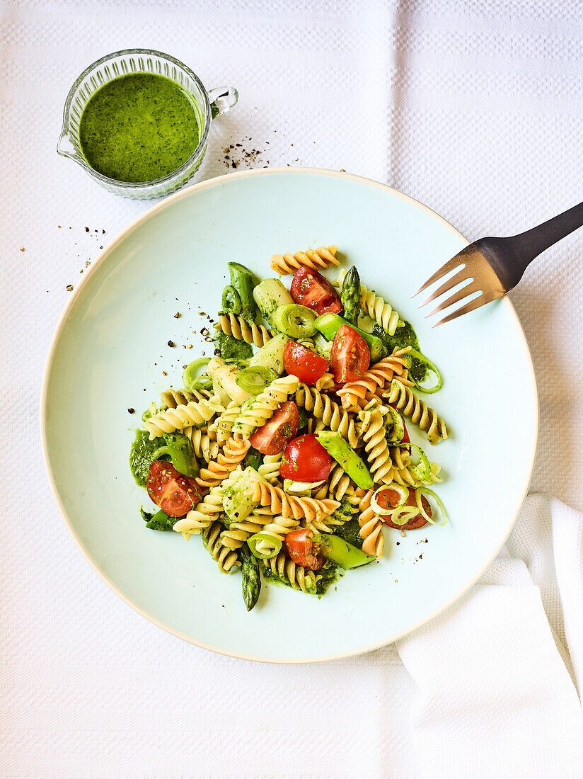 Pasta salad with vegetables and green sauce