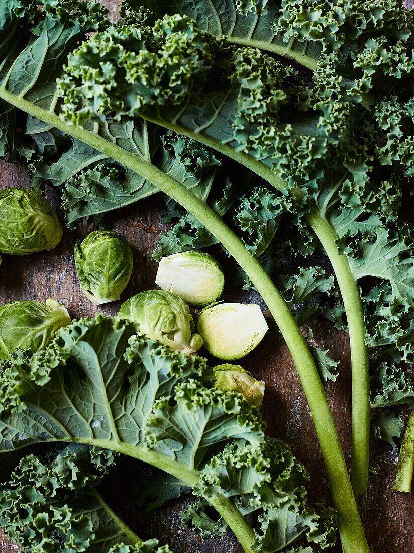 Kale and Brussels sprouts on a wooden base