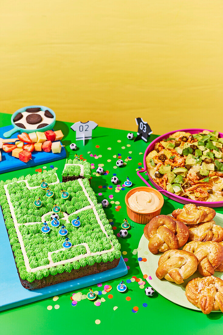 Football pitch party cake with snacks