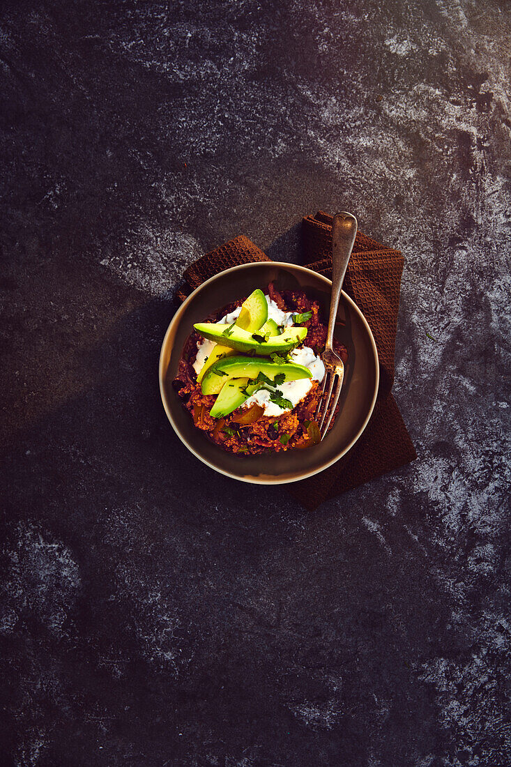 Vegetarian quinoa chilli with avocado