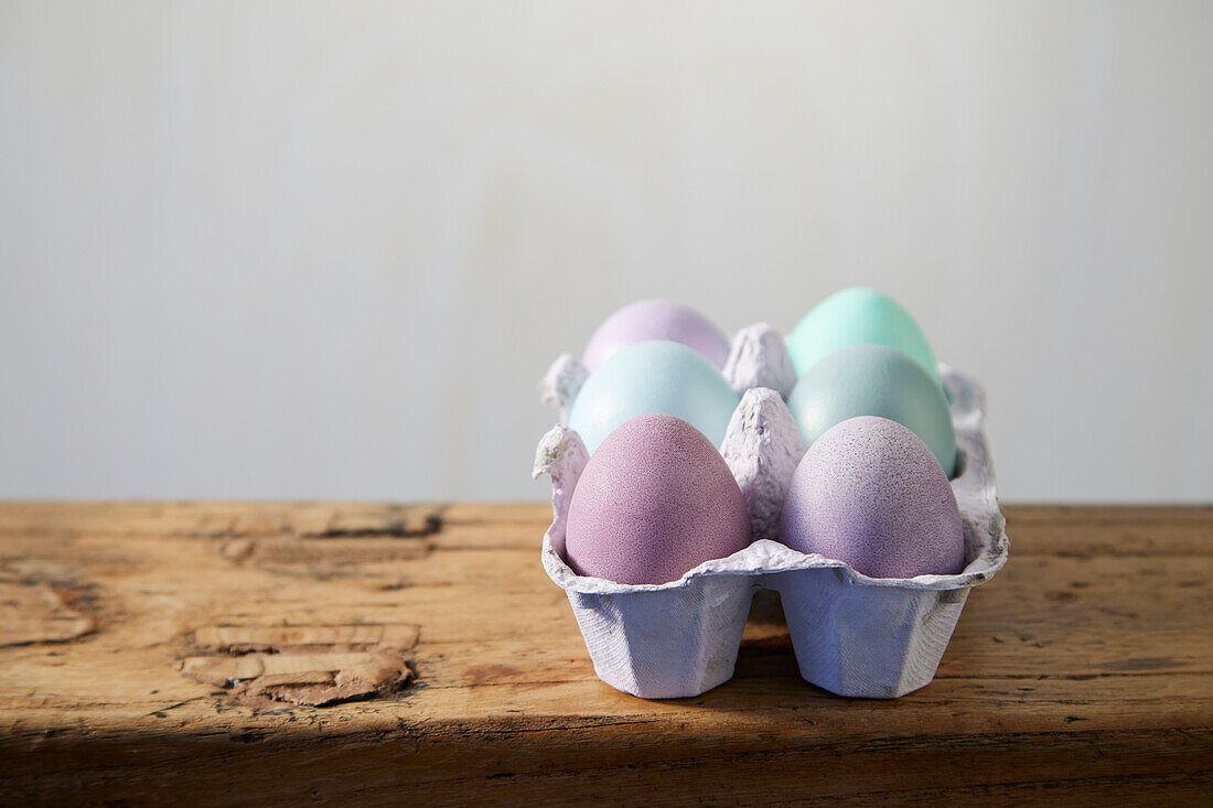 Colourful Easter eggs in egg cartons