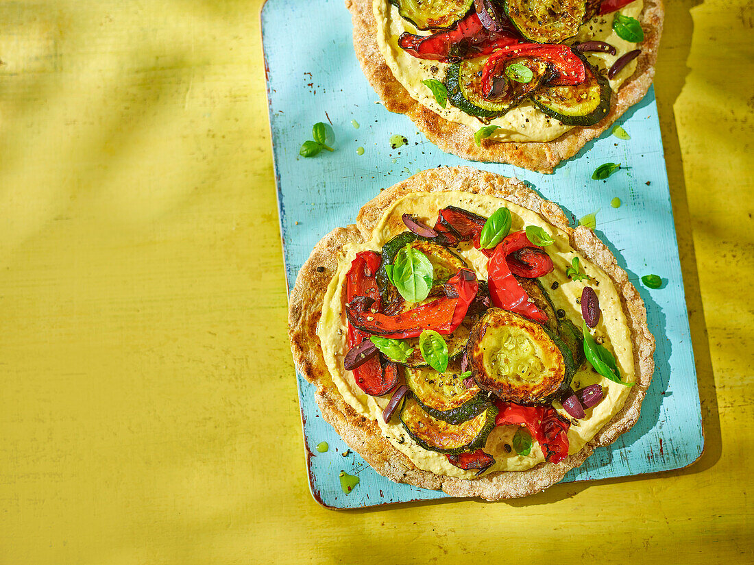 Hummus flatbread pizza with roasted vegetables