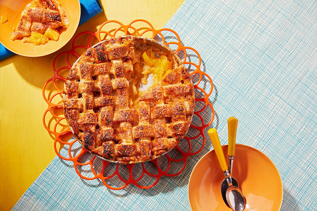 Peach cake with lattice pattern pastry topping