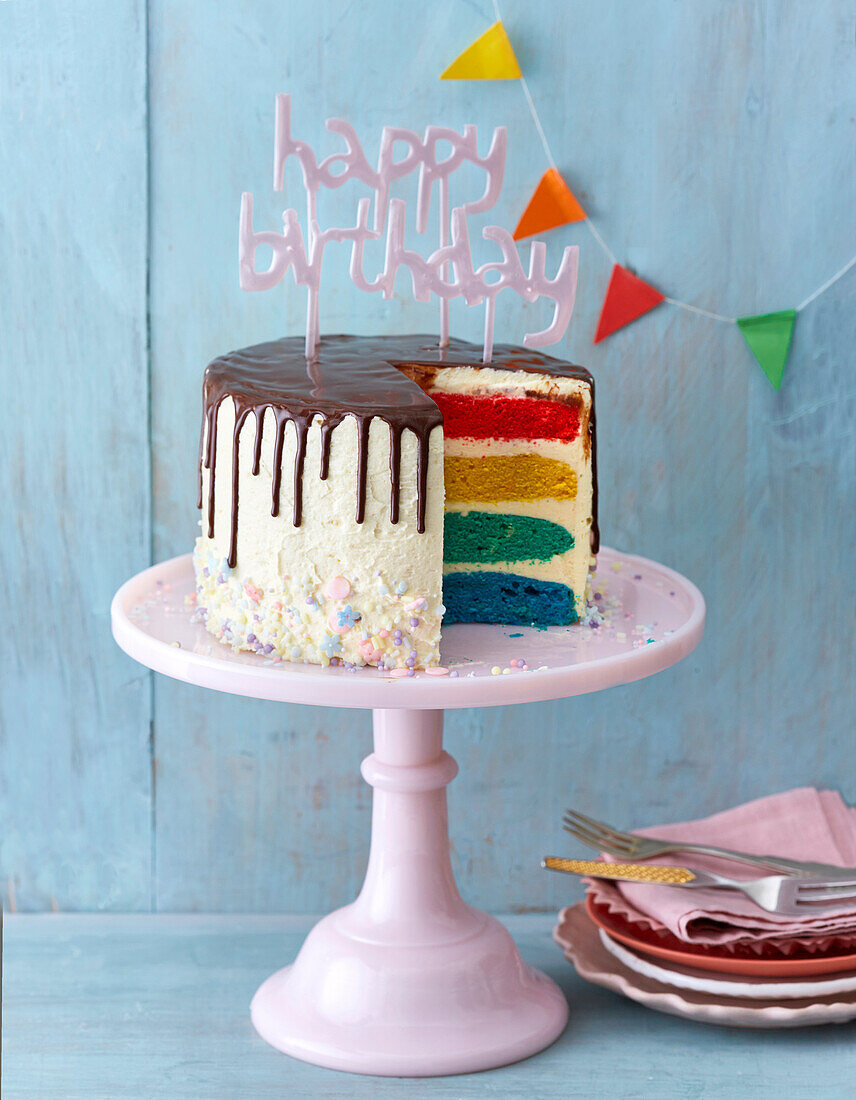 Rainbow cake with chocolate icing