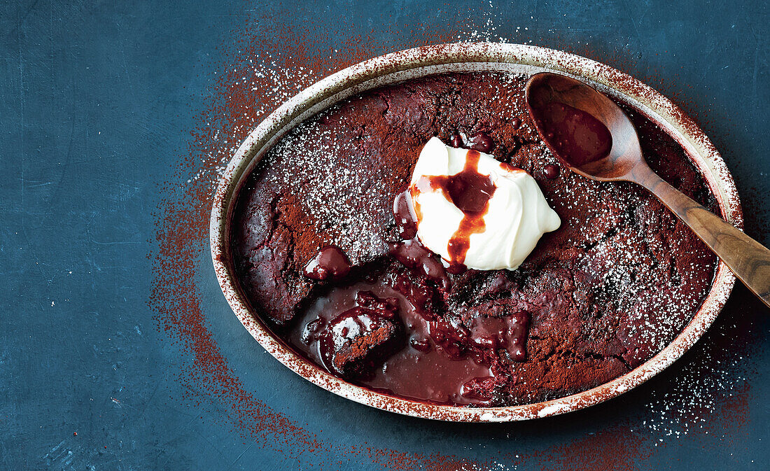 Red velvet self-saucing pudding with whipped cream