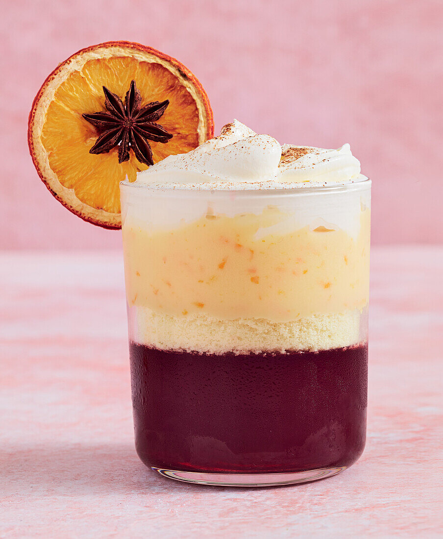 Mulled wine with whipped cream and orange slices