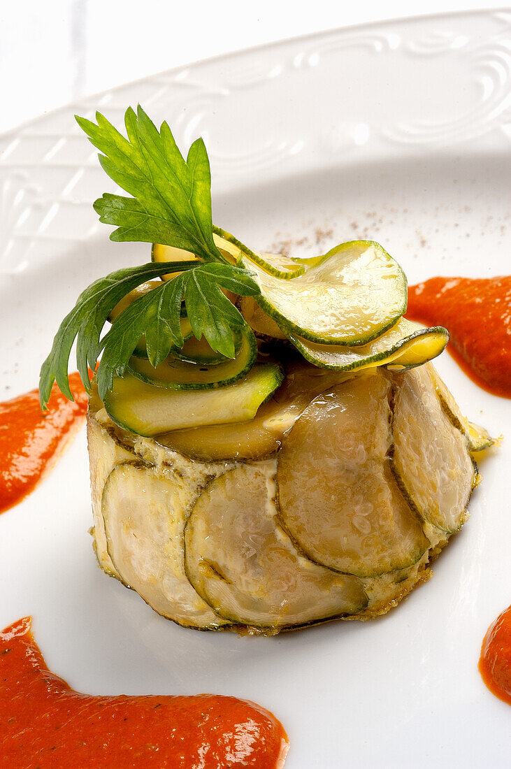 Sformato di courgette (courgette terrine) with paprika sauce